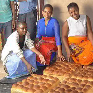 women displaying baked bread